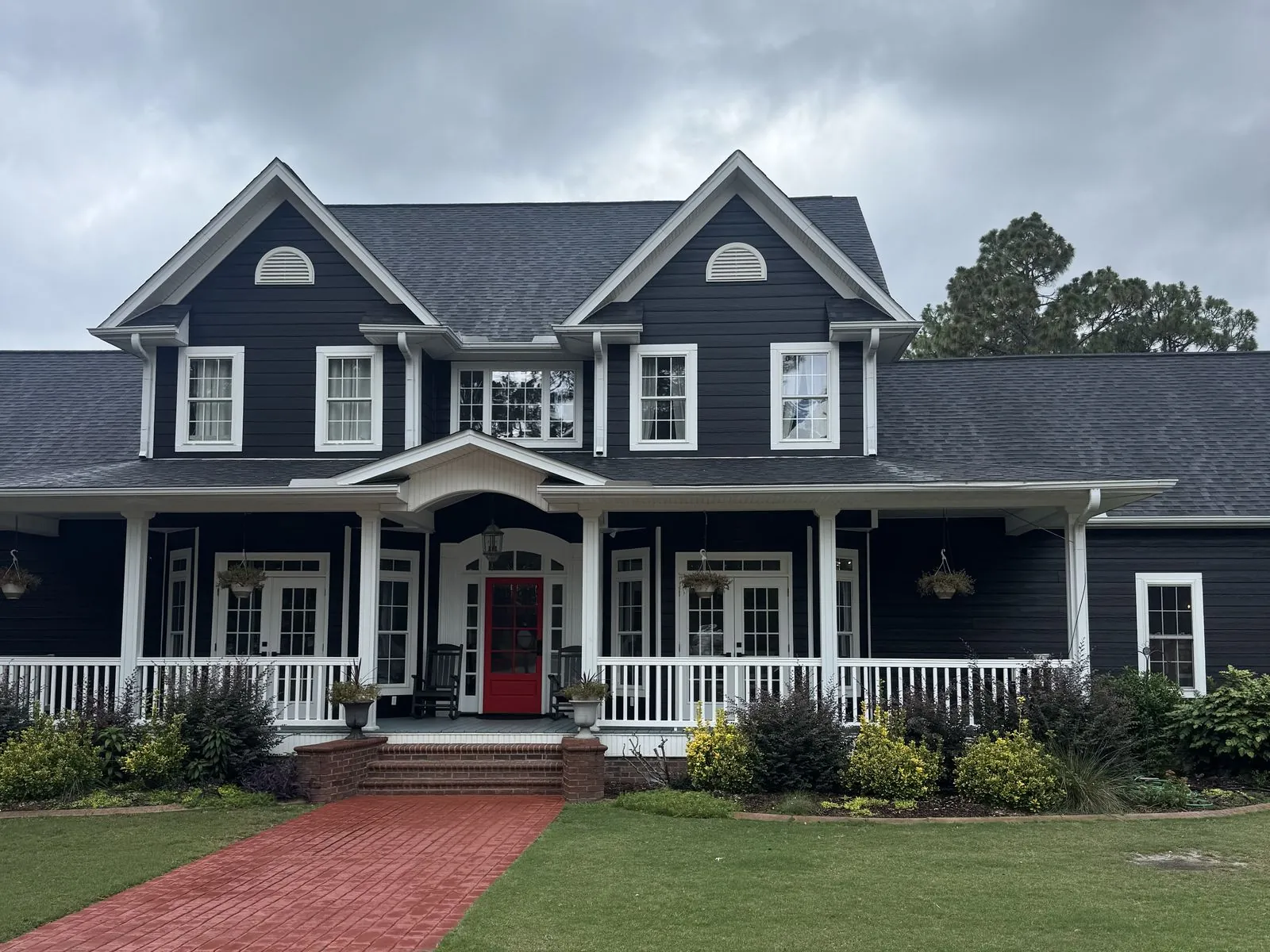 House after exterior paint, navy siding