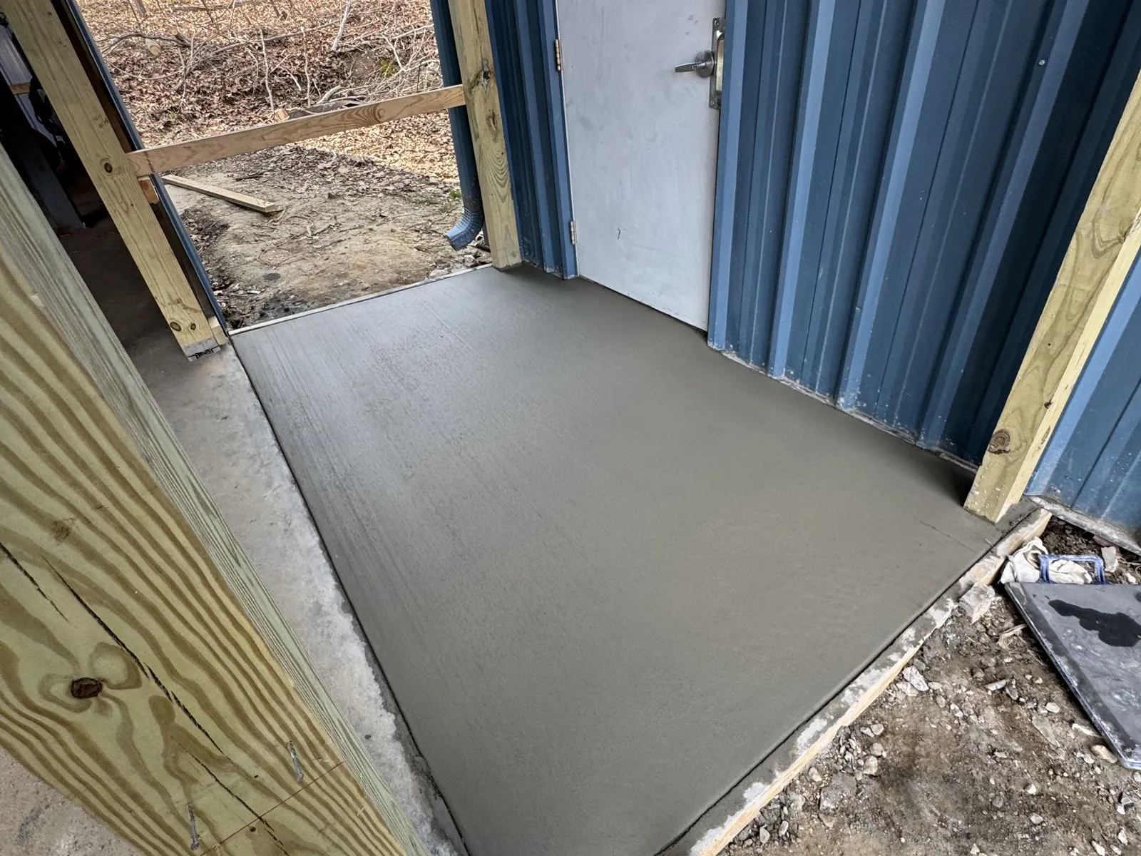 Shed entrance after new concrete pad